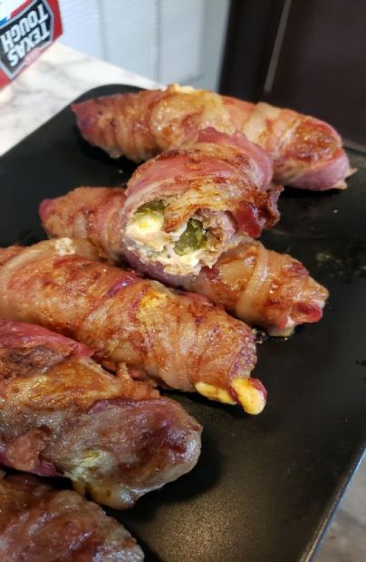 Bacon and sausage wrapped pickles with cheese