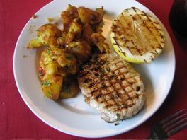 Pork chops with fryed cauliflower, potatos and tomatos - indian style