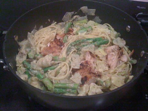 Seared herb-crusted salmon and artichoke pesto linguini