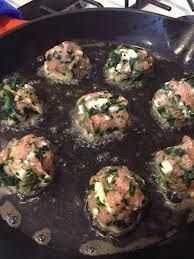 Spanikopita Meatball with Tatziki over Spring Greens