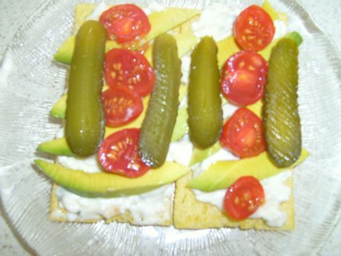 Advocado,Cottage Cheese,Chopped Chives,Gherkins and Cherry Tomatoe's on Corn Cruskies  