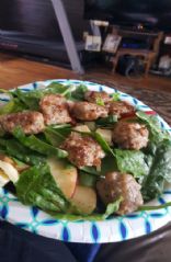 Apple cheddar spinach salad with honey apple vinaigrette with italian sausage