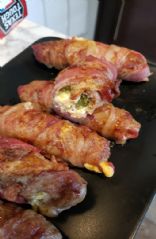 Bacon and sausage wrapped pickles with cheese