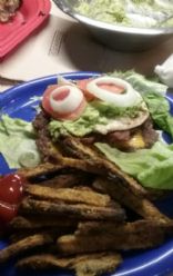 Bacon egg and cheese burger..topped with tomatoe onion and alvacado spread. . Lettuce wrap