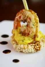 Six Spices king prawn on kaffir lime scented sweet potato mash crispy sticky rice with tom yum emulsion