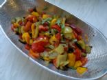 Low calorie baked pepper-tomato salad with coriander
