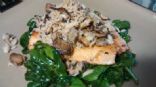 Crab topped salmon on bed of wilted spinach